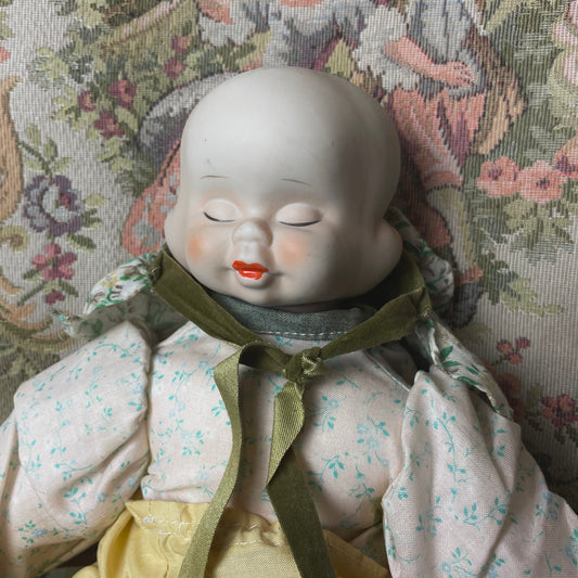 Three-Faced Porcelain Doll